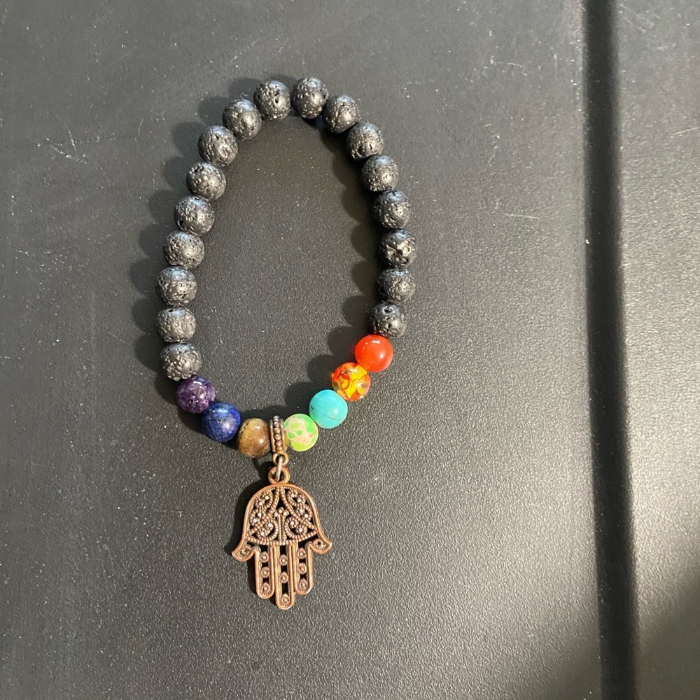 Bracelet Hasma Black with others bright colors has the Hasma Hand.
